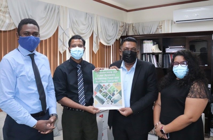 Guyana Chronicle ‘Agriculture Supplement’ handed over to Minister Mustapha